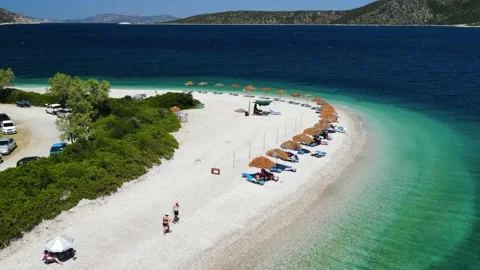 Straw umbrellas on the beach Stock Footage 237521803