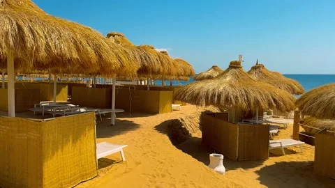 Straw umbrellas at the beach in Malaga. Costa del Sol, Andalusia, Spain Stock Footage 239178666