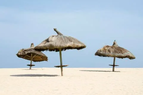 Straw Umbrellas on the Beach Stock Photos