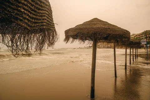 Straw Umbrellas on a Beach Stock Photos