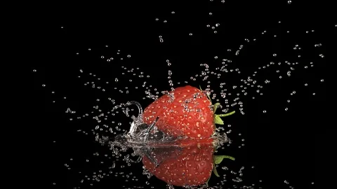 Strawberrie Falls on the Table, Splashing Drops. Slow Motion. Stock Footage 111677094
