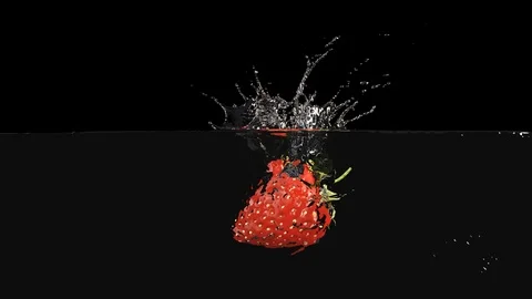 Strawberrie Falls on the Table, Splashing Drops. Slow Motion. Stock Footage 111677139