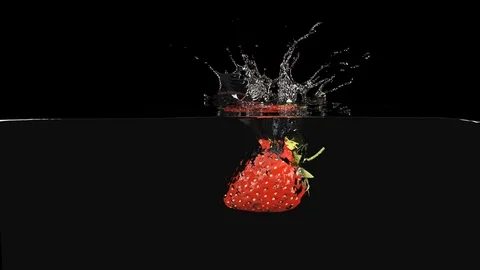 Strawberrie Falls on the Table, Splashing Drops. Slow Motion. Stock Footage 111677226