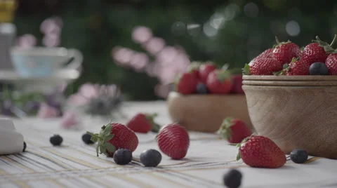 Strawberries and blueberries on table Stock Footage 67029956