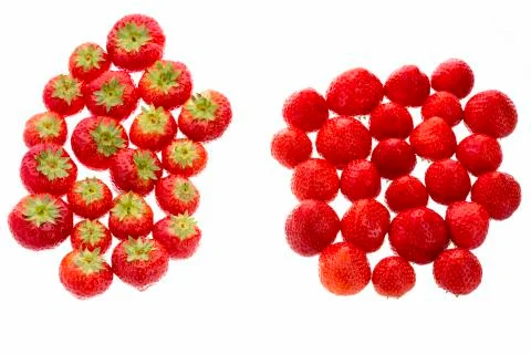 Strawberries Arranged In Two Groups Over White. Stock Photos