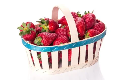 Strawberries in basket Stock Photos