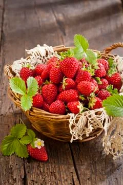 Strawberries in basket Stock Photos