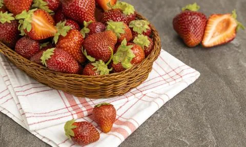 Strawberries in a basket on the table. Close up. 库存照片
