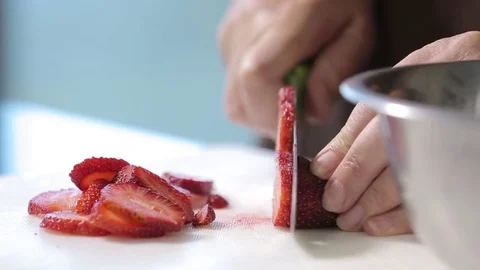 Strawberries being chopped Stock Footage 77046077