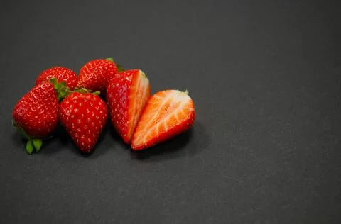 Strawberries on black background Stock Photos