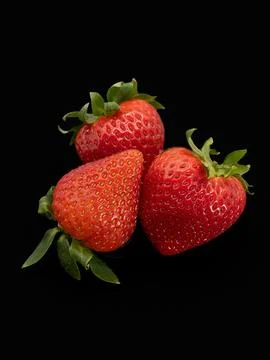 Strawberries on a black background Stock Photos