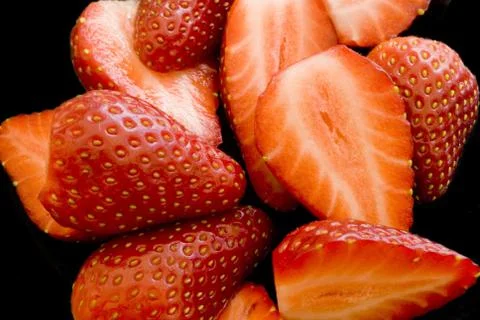 Strawberries on black Stock Photos