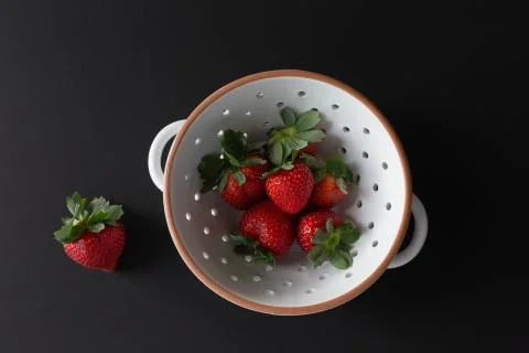 Strawberries in bowl Stock Photos