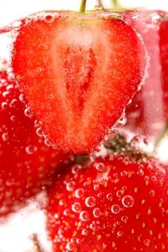 Strawberries with bubbles in water Stock Photos