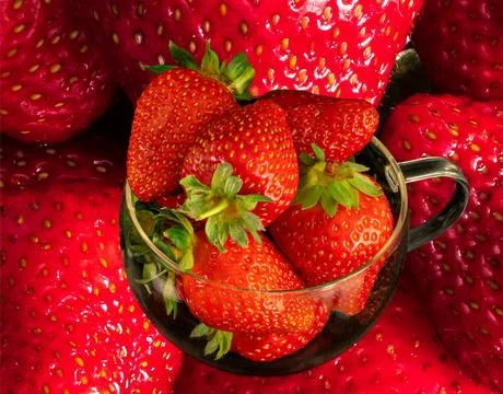 Strawberries close-up lying on the table Stock Photos