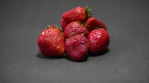 Strawberries in closeup with black background Stock Footage 204136664