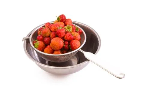 Strawberries in a colander Stock Photos