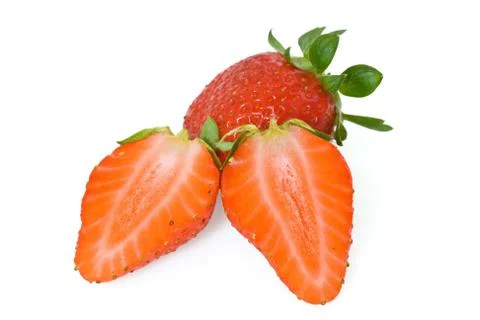 Strawberries cut in half Stock Photos
