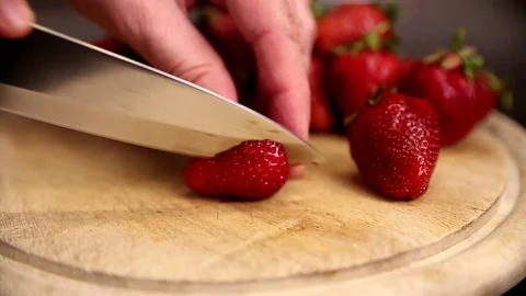 Strawberries cut by knife Video stock 90836355