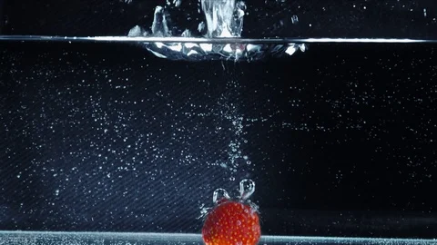 Strawberries fall, hit the bottom and pops up Stock Footage 118132823