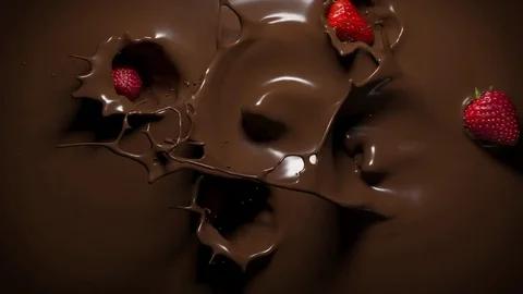 Strawberries fall into melted chocolate Stock Footage 83951123