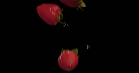Strawberries fall in slow motion against Black Background 5 Stock Footage