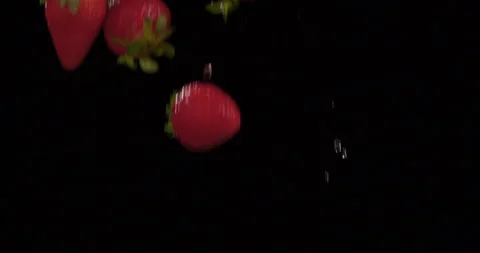 Strawberries fall in slow motion against Black Background 3 库存影片 142187390