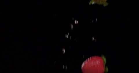 Strawberries fall in slow motion against Black Background 2 库存影片 142187471