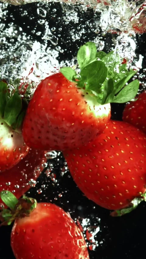 Strawberries fall underwater with bubbles. Filmed is slow motion 1000 fps Stock Footage 335292293
