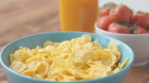 Strawberries falling into cereal in slow motion Stock Footage 68952669