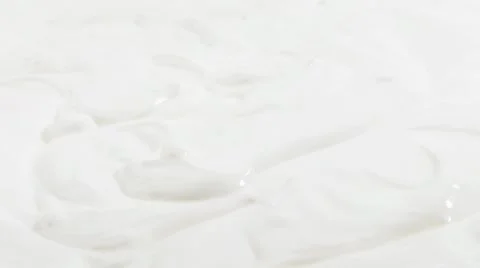 Strawberries falling into cream Stock Footage 8571663