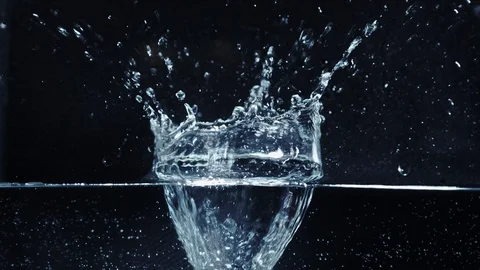 Strawberries falling deep into the water Stock Footage 118132792