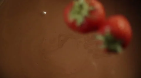 Strawberries Falling into Melted Chocolate Stock-Footage 66732487
