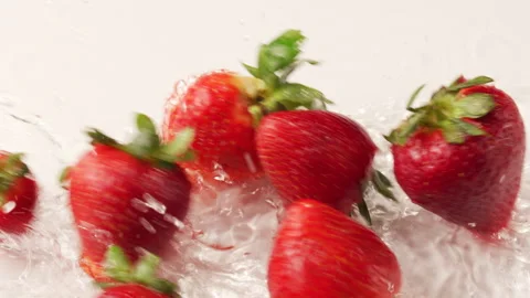 Strawberries Floating in Milk Stock Footage 309826339