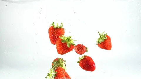 Strawberries floating in water Stock Footage 249959209