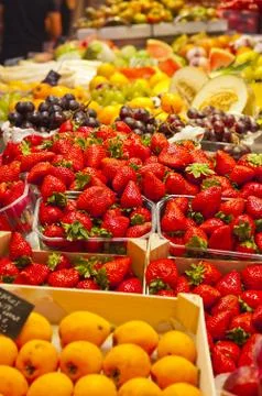 Strawberries in a fruit stall Stock Photos