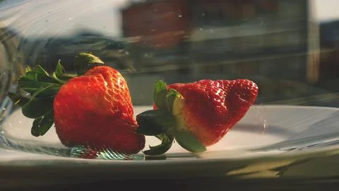 Strawberries in a glass container Stock Photos
