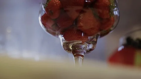 Strawberries in a glass on a table Stock-Footage 87825482