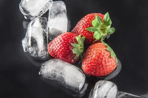 Strawberries with ice Stock Photos
