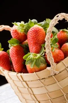 Strawberries inside a basket Stock Photos