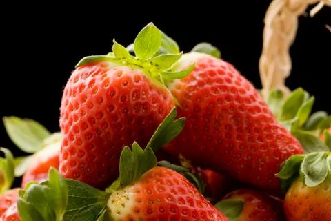 Strawberries inside a basket Stock Photos