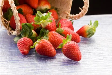 Strawberries inside a basket Stock Photos