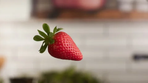 Strawberries jumping in the air ready to be eaten Stock Footage 156202149