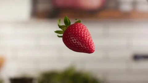Strawberries jumping in the air ready to be eaten Stock Footage 156202247
