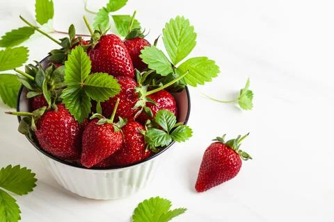 Strawberries with leaves. Stock Photos