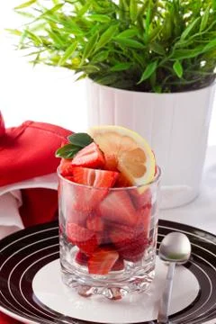 Strawberries with lemon Stock Photos