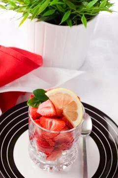 Strawberries with lemon Stock Photos