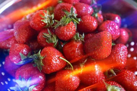 Strawberries with light reflections Stock Photos