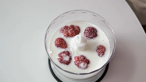 Strawberries in milk Stock Footage 114304895