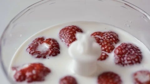 Strawberries in milk Stock Footage 114305195